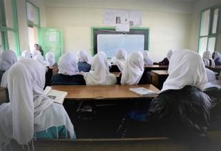 Female Classroom with Empty Desk when a Student was no longer Permitted to Continue Education once Married