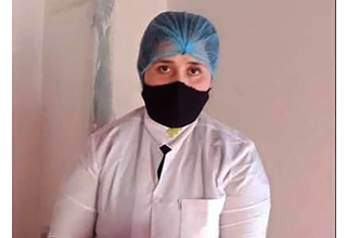 a midwife wearing a hair net and face mask