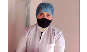 a midwife wearing a hair net and face mask
