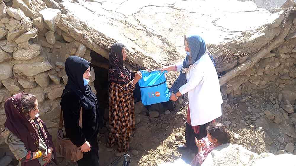 A health worker distributing Dignity Kits