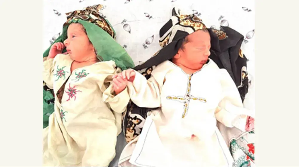 Midwife delivers surprise twins